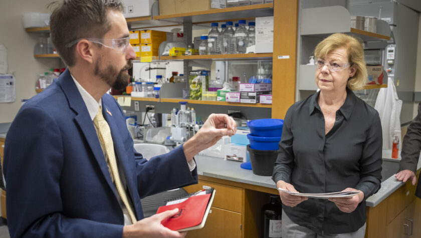 Cody Wenthur speaks with Tammy Baldwin in his lab