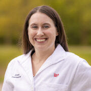 Jenny Donar portrait outside in a white coat