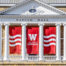 front of Bascom Hall with banners reading "All Ways Forward"