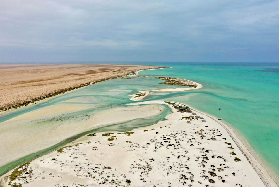 Beautiful view of white beaches and turquoise water along the coastline of Oman