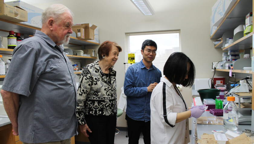 John and Inara Apinis visit the lab of Professor Weiping Tang