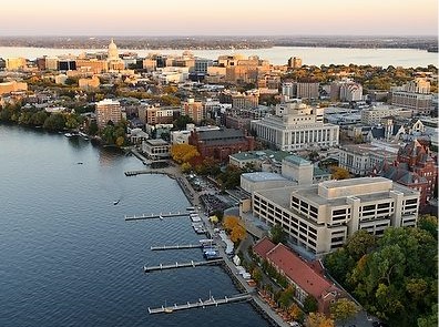 aerial view of Lake Mendota, featuring Monona Terrace at Memorial Union, Red Gym, and Helen C. White Library