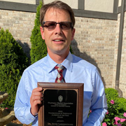 John Davis poses with Dean Steve Swanson following the presentation of his award