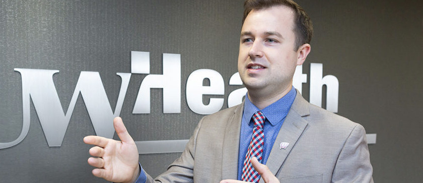 MS Pharmacy student Brandon Harkonen answers questions at a UW Health conference