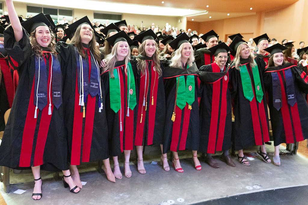 Class of 2022 PharmD students in the front row of the Hood Ceremony enthusiastically sing a rousing round of Varsity in the Memorial Union Theater