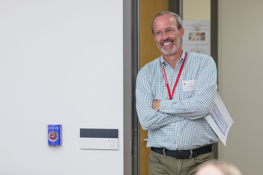 Dave Mott smiles in a doorway