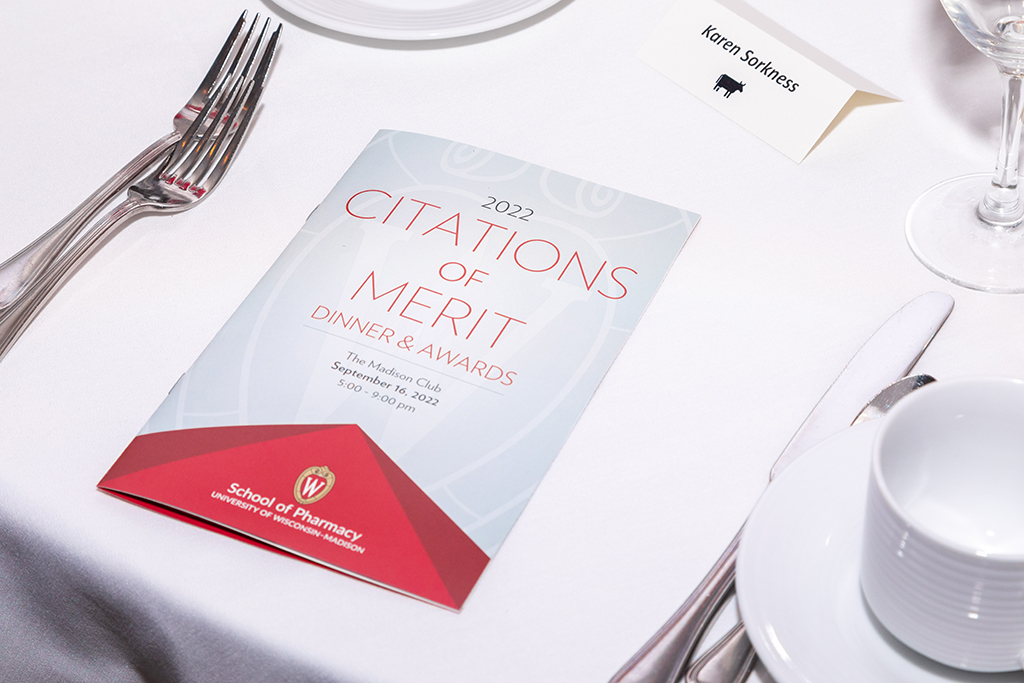 A Citations of Merit program sits on a table.