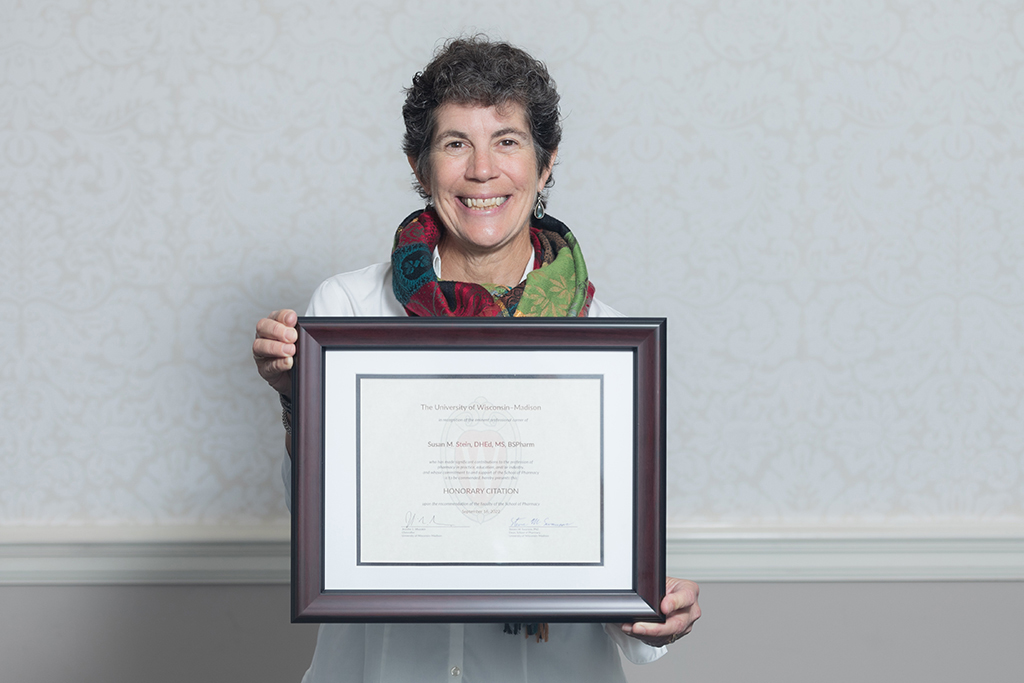 Susan Stein holding her Citation of Merit.
