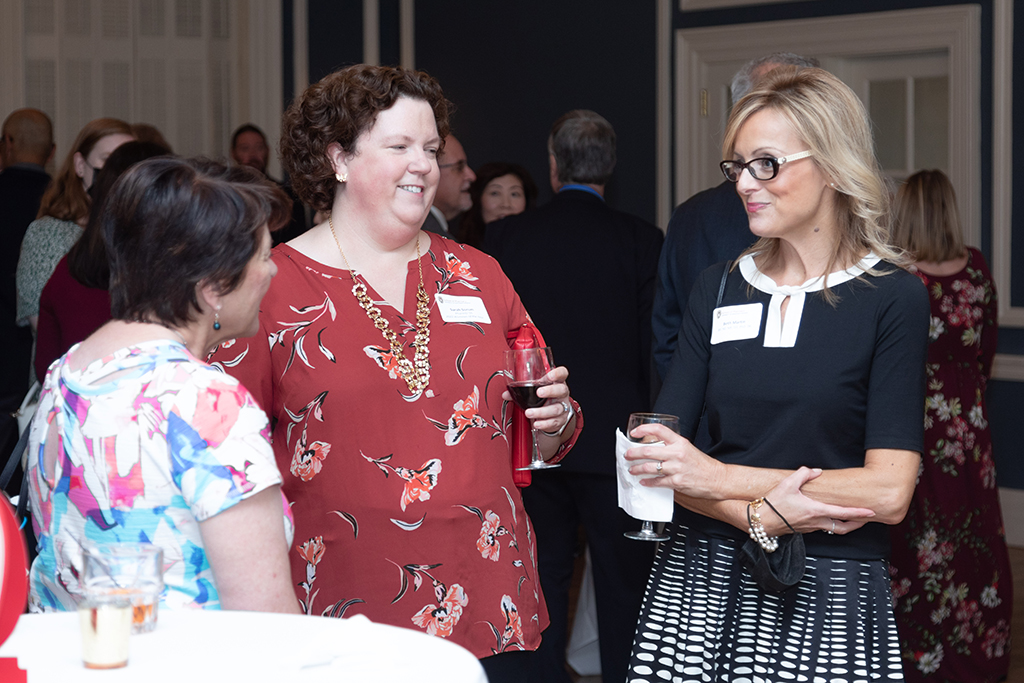 Sarah Sorum and Beth Martin speak with another attendee of the Citations of Merit event.