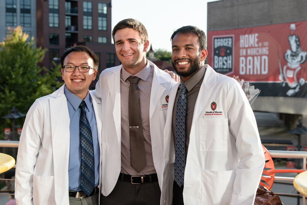 Pharm students together wearing their white coats after white coat ceremony