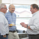 Michael Taylor, Ron Burnette, and Dean Steve Swanson chat together