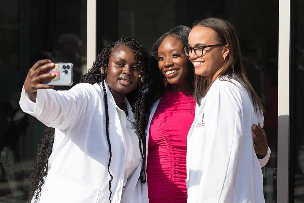 A group of students pose outside after the 2022 White Coat Ceremony.