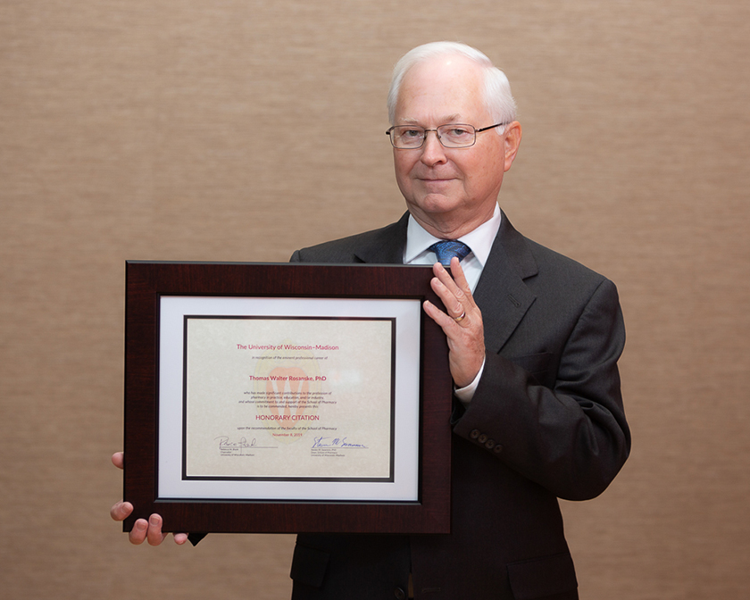 Thomas Rosanske holding his Citation of Merit award.