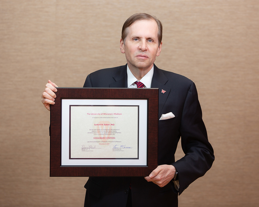 Eric Goldman holding Sanford Bolton's Citation of Merit award