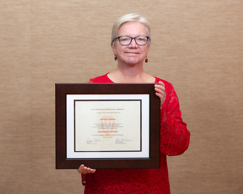 Jeanette Roberts holding her Citation of Merit award.