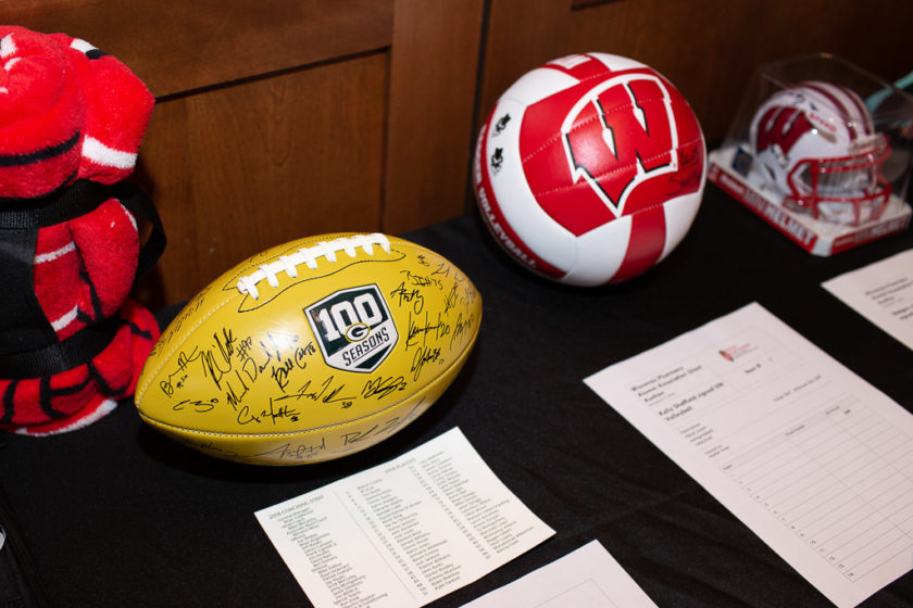 Signed balls for silent auction at Alumni Tailgate and Viewing party