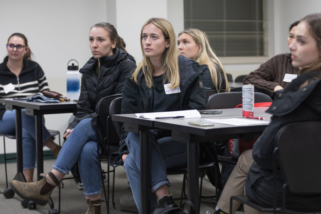 PharmD students watch a presentation during the DiveRxsity Dialogues event.