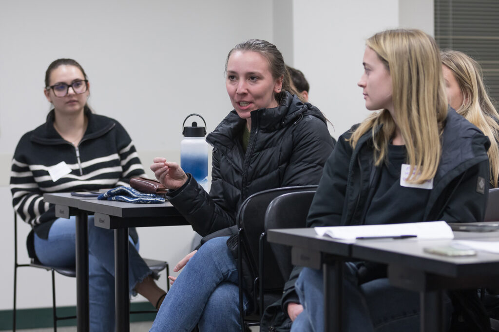 PharmD students engage in conversation during the DiveRxsity Dialogues event.