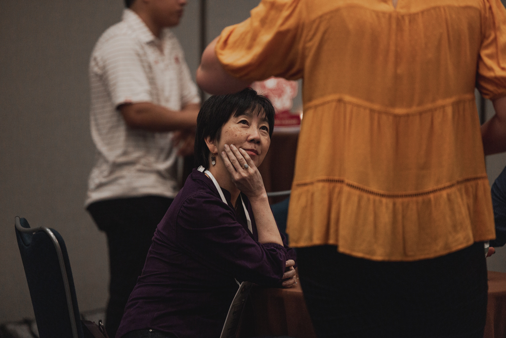 Michelle Chui watches an attendee speak