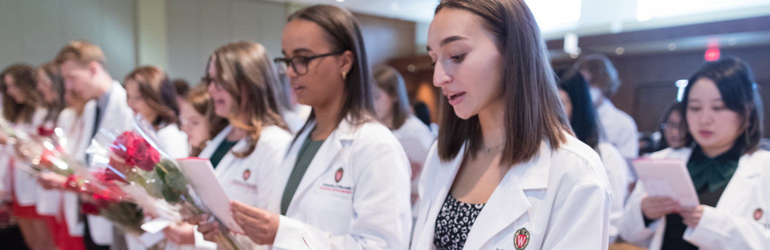 PharmD students read the Pharmacist's Oath at the annual White Coat ceremony