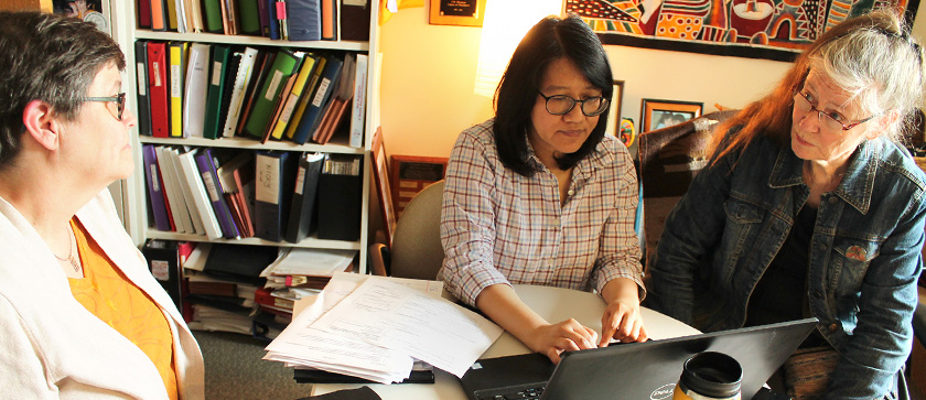 An HSRP student discusses research data with faculty