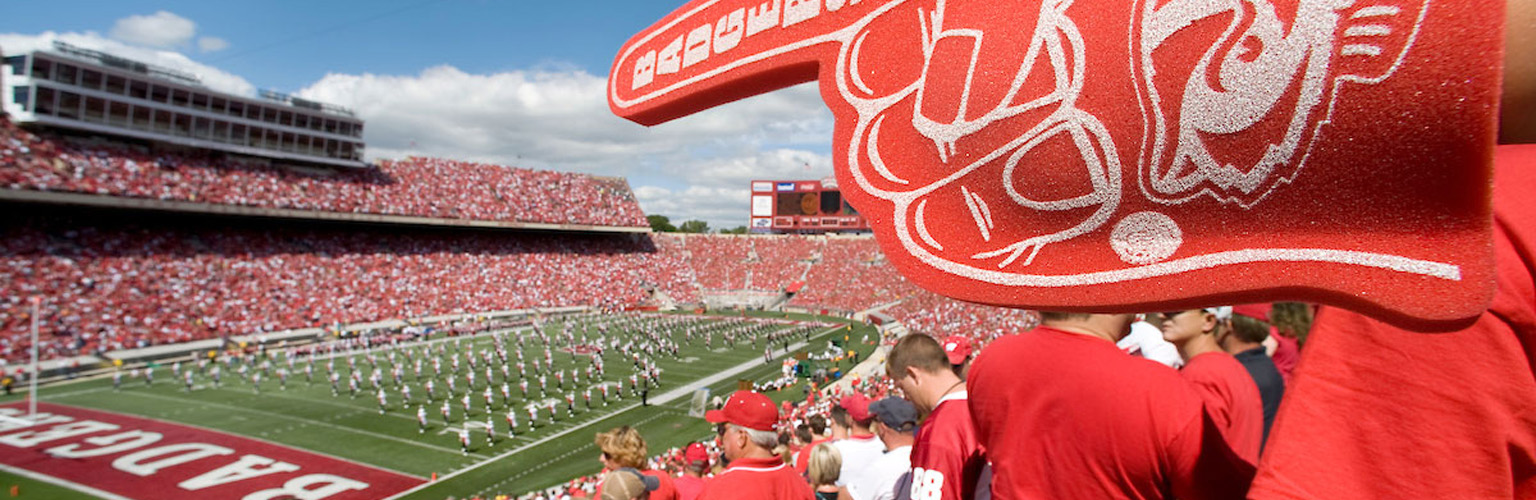 Badger football fans dressed in red fill Camp Randall during a game