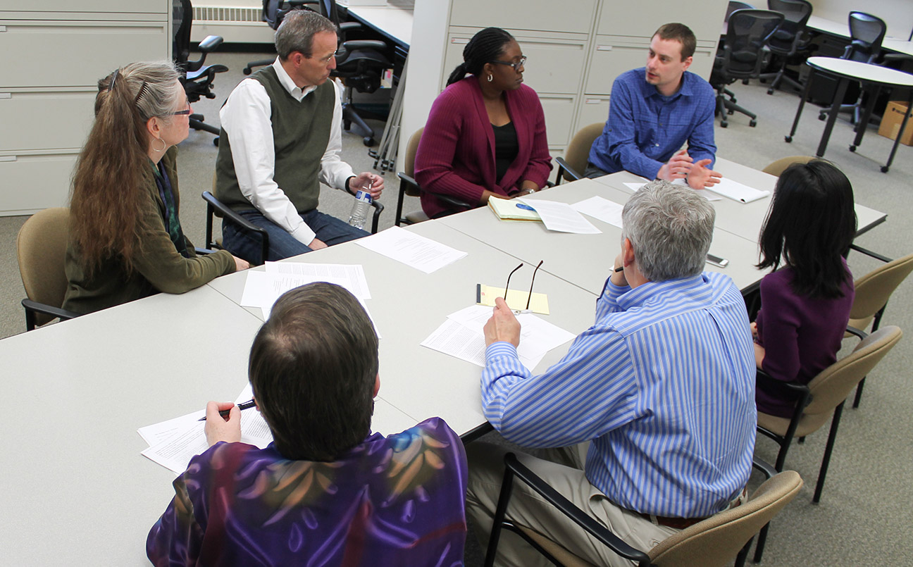 Members of the Sonderegger Research Center discuss upcoming projects: Betty Chewning, David Mott, Olayinka Shiyanbola, Kevin Look, Michelle Chui, Dave Kreling, and Dale Wilson.