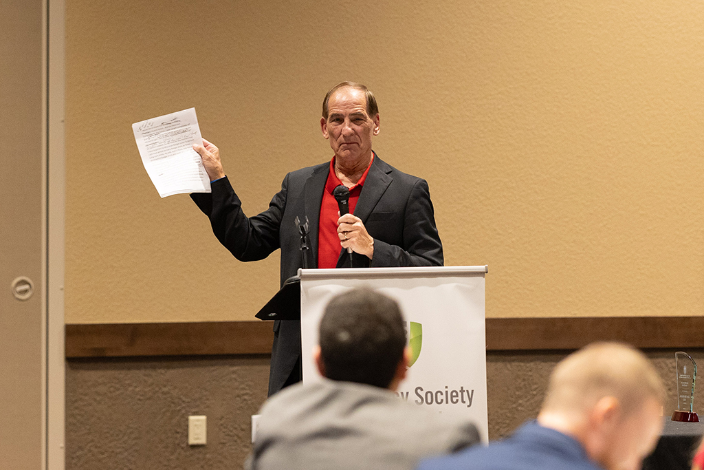 Jim Koeller talks into a microphone