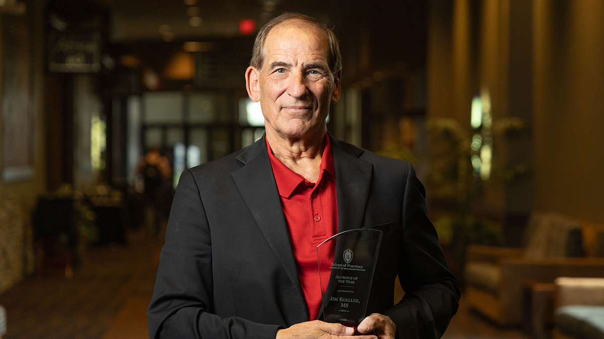 Jim Koeller poses with his award